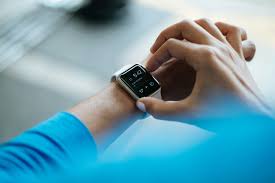 female using wrist bp monitor to check blood pressure